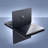 A silver laptop is shown with an ultra-slim hard shell case, resting on a dark surface.