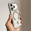 A hand holds a slim magnetic phone case for iPhone Magsafe with a light beige color.