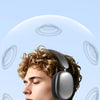 A young man wearing silver over-ear headphones, demonstrating surround sound effects.
