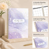 A5 monthly planner with purple marble design and gold spiral binding showing planning pages for 2026–2028
