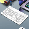 A white 10-inch Bluetooth keyboard and mouse combo with a rechargeable battery resting on a gray surface.