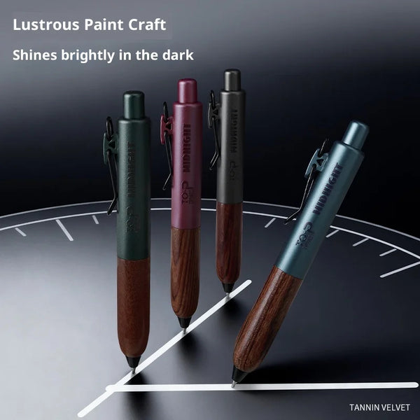 A set of three Top Midnight gel pens with wood grips displayed on a dark surface.