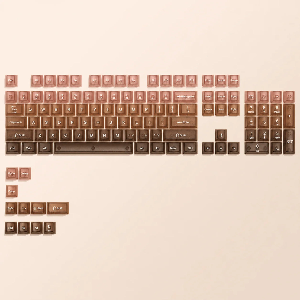 A close-up view of a full set of crystal clear RGB keycaps for a mechanical keyboard, showing various letter and function key