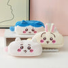 Three Chiikawa plush pencil cases in blue, white, and cream colors displayed on a light surface.