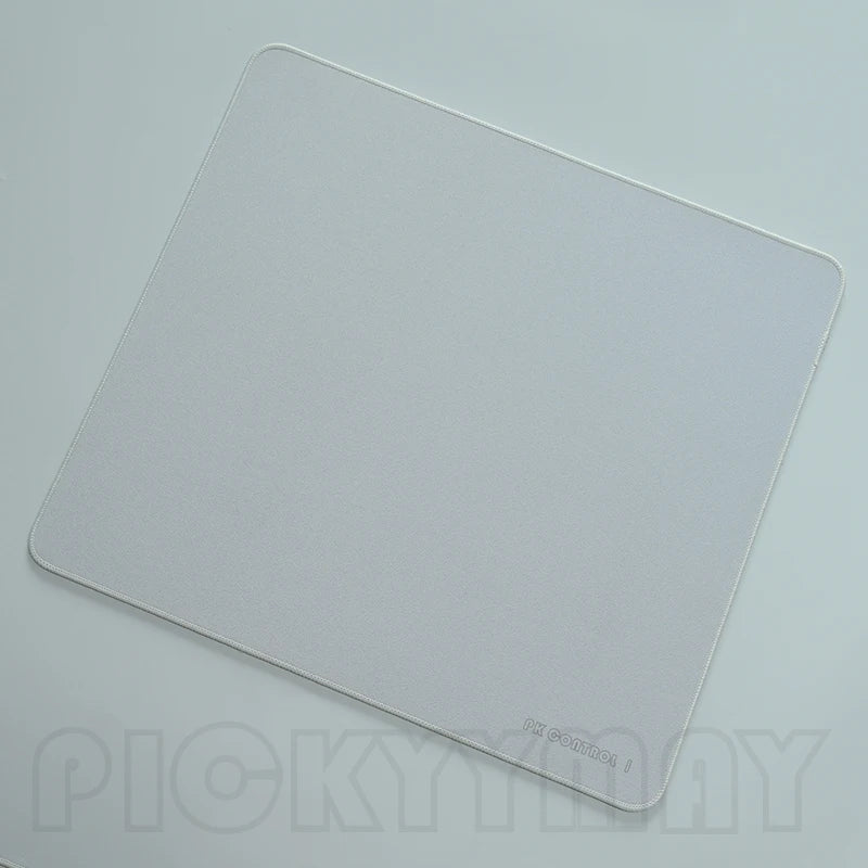 A white professional gaming mouse pad desk mat viewed from above.