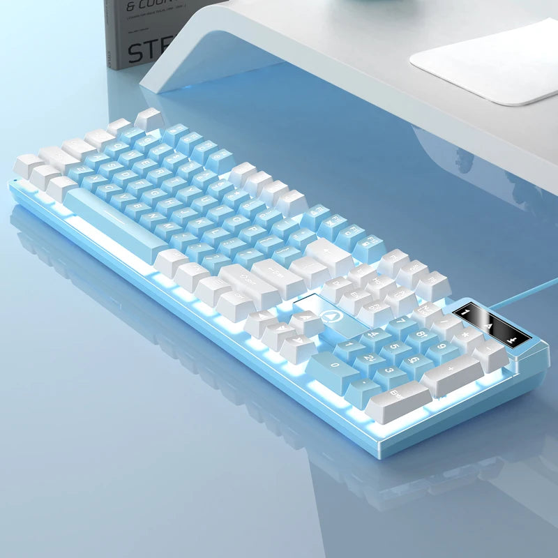 A light blue low profile wired gaming keyboard with a numeric keypad is shown on a white surface.