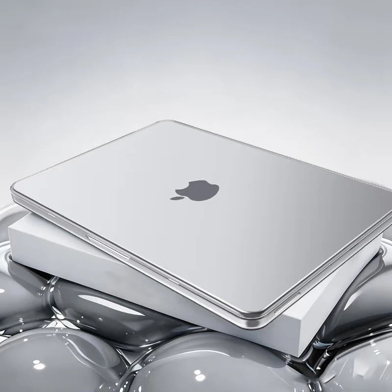 A silver Apple laptop is shown inside a white protective case, resting on a reflective surface.