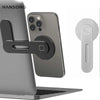 Silberne faltbare magnetische Halterung für Laptop und Telefon mit Klemmmechanismus.
