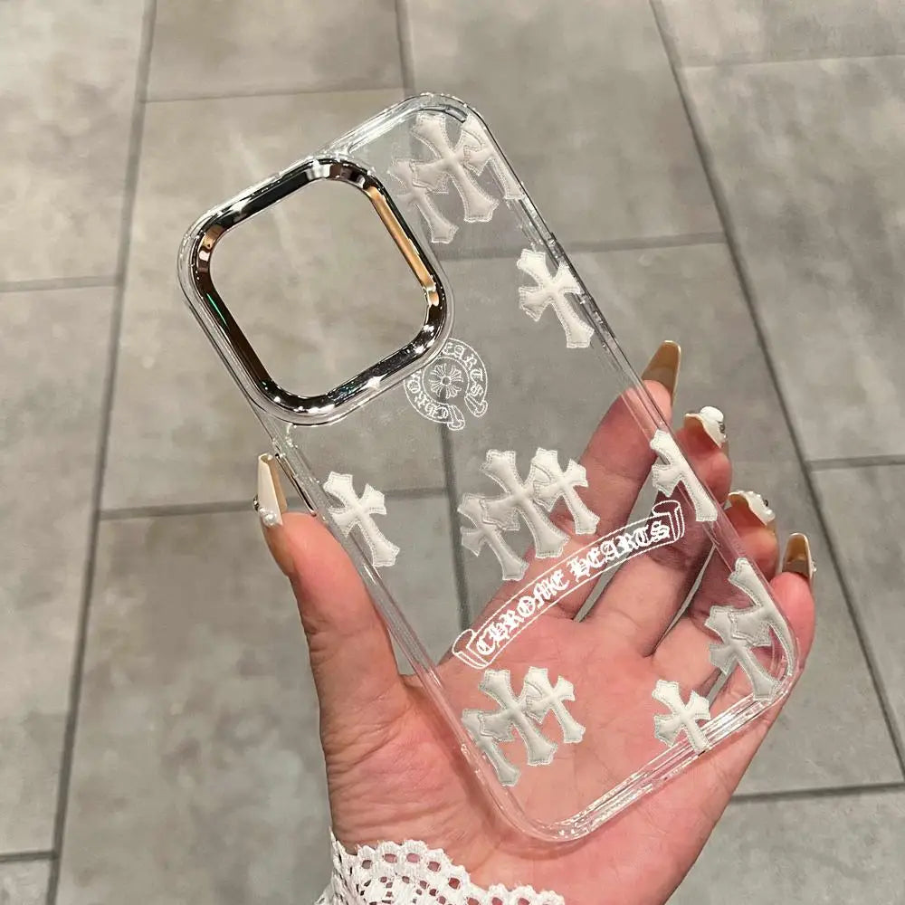 A hand holds a clear holographic gradient phone case for an iPhone featuring a cross design.