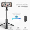 A black selfie stick tripod with a camera, fill light, and wireless remote control for taking photos.
