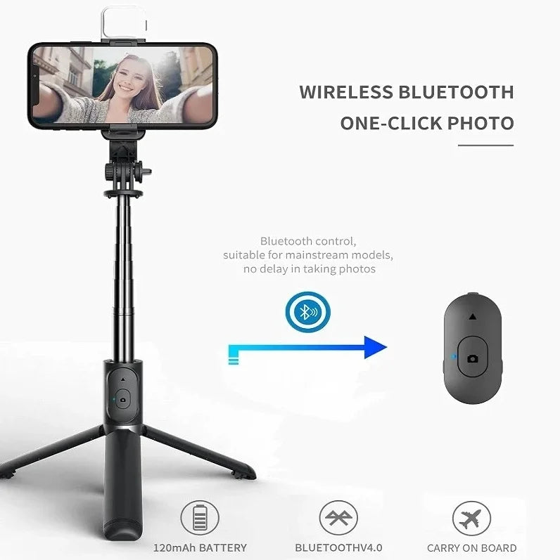 A black selfie stick tripod with a camera, fill light, and wireless remote control for taking photos.