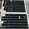 A set of translucent pink jelly keycaps for mechanical keyboards displayed in an open case.
