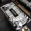 An oversized black and white mouse pad featuring the Death Note design with text like I love you and rules.