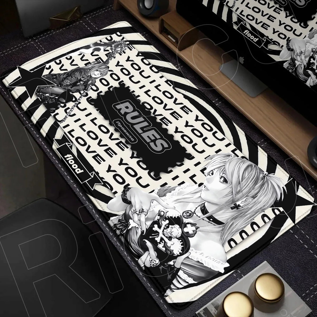 An oversized black and white mouse pad featuring the Death Note design with text like I love you and rules.
