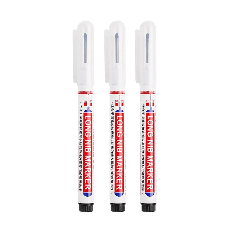 Three white permanent paint marker pens with clear tips are shown standing upright.