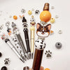 A collection of rotating gradient acrylic beaded pens and decorative elements arranged on a white background.