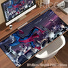 A large desk mat featuring a Spider-Man anime design with a cityscape and dark background.