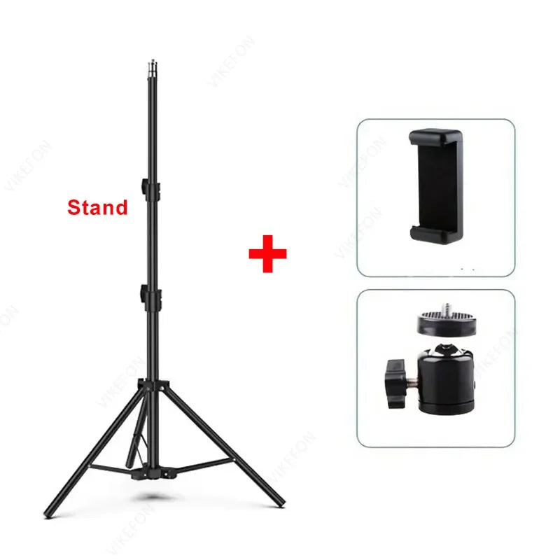 A black adjustable phone tripod stand with a mounting plate and a separate accessory shown in detail.