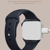 A black smartwatch with a white case and band is shown, highlighting its strong magnetic attraction for stable charging.