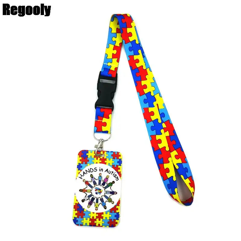 Buntes Puzzle-Teil-Lanyard mit Hand in Autism-Design an einem Schlüsselring