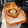 A hand holds an orange-colored iPhone magnetic stand case with a kickstand and lens protection feature.