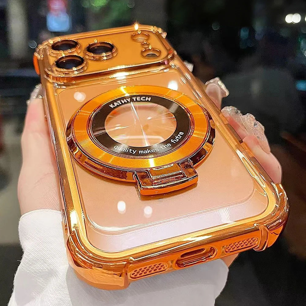 A hand holds an orange-colored iPhone magnetic stand case with a kickstand and lens protection feature.