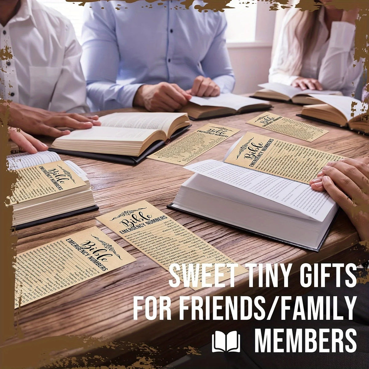 A close-up of several open and closed Bible verse books on a wooden table with hands visible, suggesting decorative bookmarks