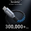 Anker 100-Jahres-Bend-Dauerhaftigkeit-Kabel, aufgewickelt vor dunklem Hintergrund.