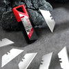 A red and black precision T-shape knife blade set is displayed on a gray surface with several silver metal blades scattered a