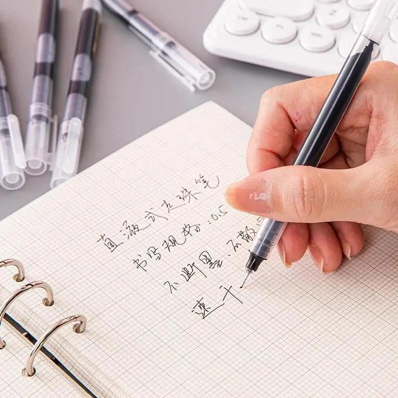 A hand is writing on a notebook with a black gel pen, demonstrating the use of precision pens.