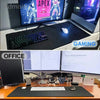 An extra large abstract desk mat used for gaming and office work, featuring a black surface.