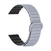 A gray adjustable magnetic loop watch band shown from the side.