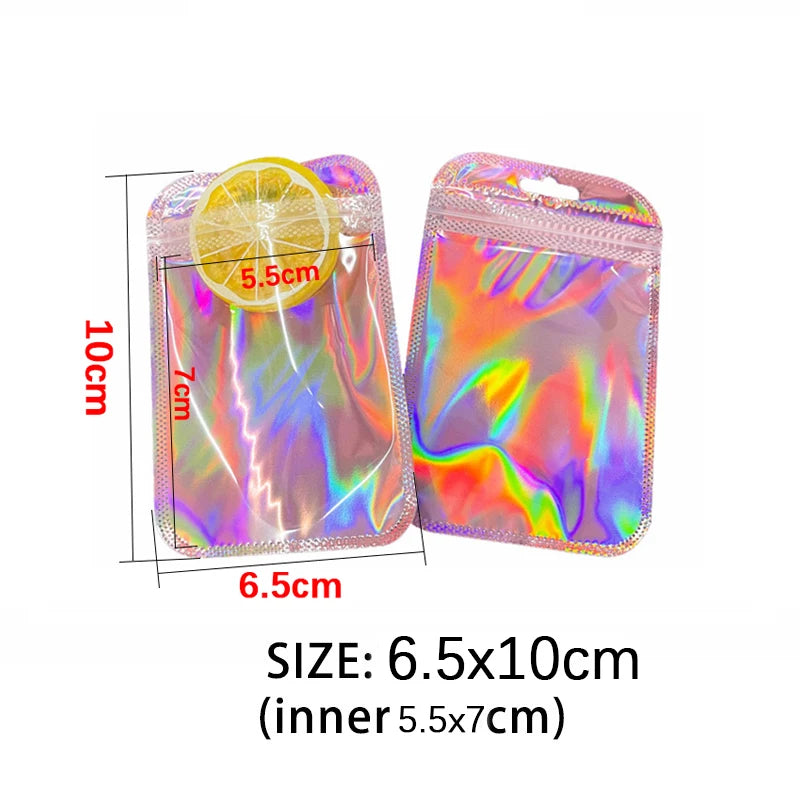 Iridescent self-sealing jewelry pouches with a lemon-shaped clear pouch and a pink iridescent pouch.