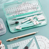 A collection of geometry drawing tools including an eraser, protractor, pencil, lead, compass, ruler, and a pencil converter 