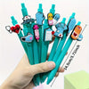 A hand holds a pack of six medical theme ballpoint pens featuring various medical symbols and text.