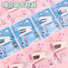 Pack of cartoon mini staplers in pink and blue packaging for students and office use