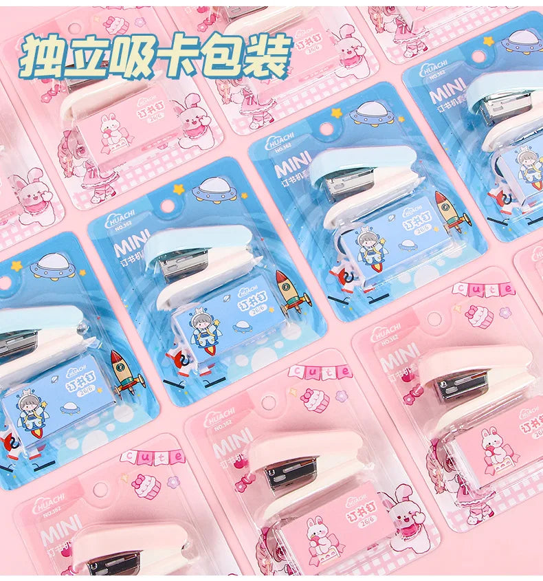 Pack of cartoon mini staplers in pink and blue packaging for students and office use