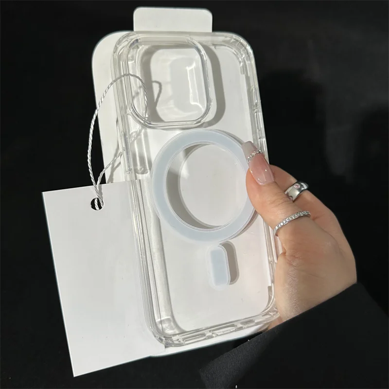 A clear magnetic phone case for an iPhone is shown being held by a hand against a white card.