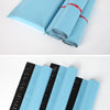 Rolls of light blue reusable waterproof poly shipping bags stacked and laid out.