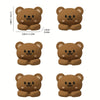 A set of four brown cartoon bear desk cable organizers shown from the top and side views.