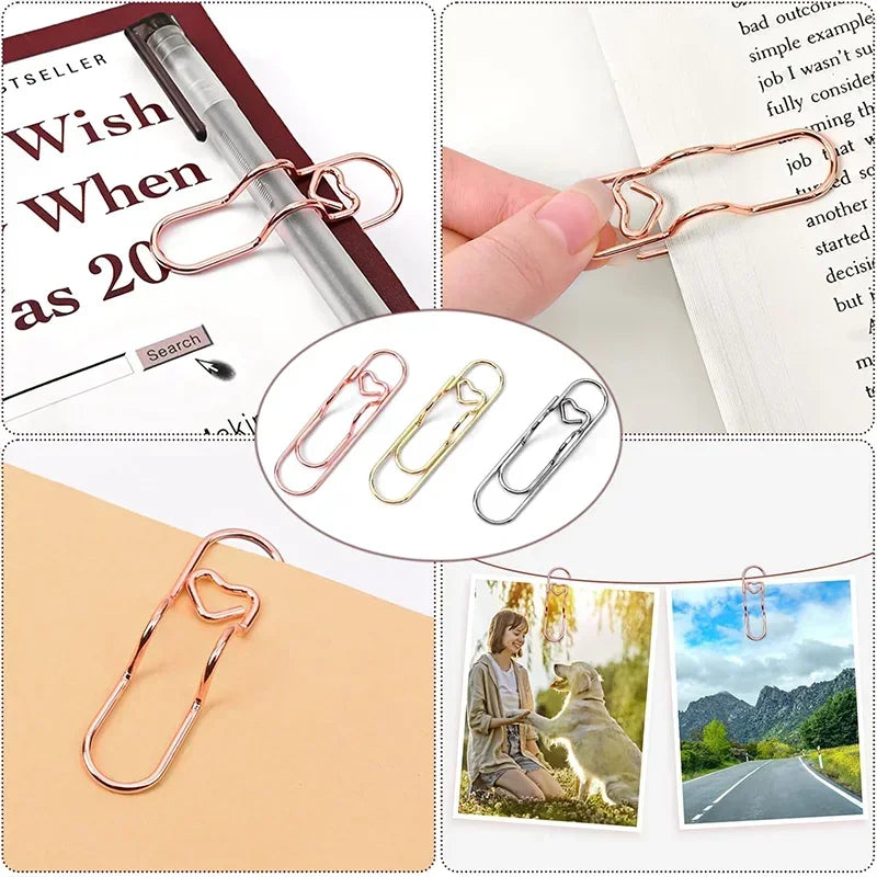 Elegant rose gold metal pen clips used to secure pages in notebooks and journals.