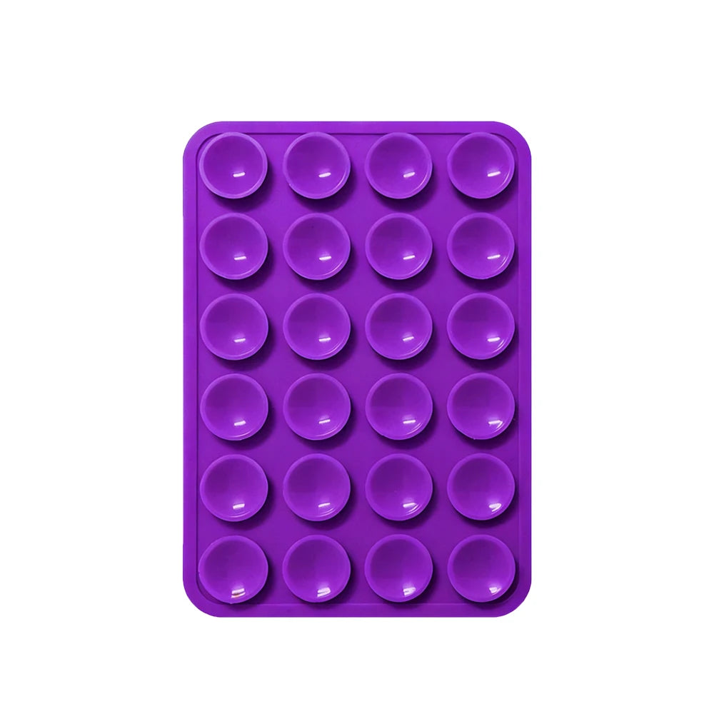 Sujetador de teléfono de silicona púrpura y resistente con múltiples orificios circulares.
