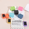 A set of colorful privacy protection roller stamps in various shades of green, pink, black, and blue are displayed on a white