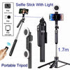 A portable selfie stick with a light and tripod setup for taking photos or videos.