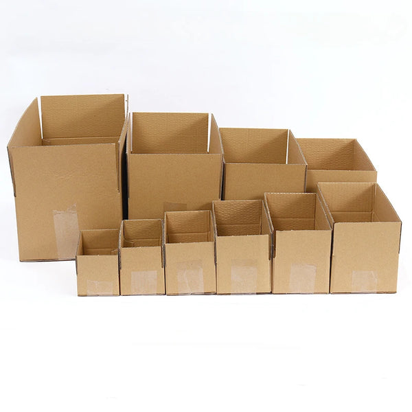A row of brown kraft cardboard shipping boxes, stacked and arranged for bulk packaging.
