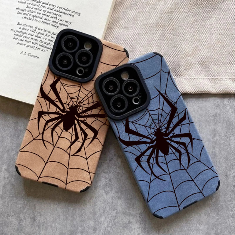 A pair of phone cases featuring intricate spider web designs in brown and blue tones.