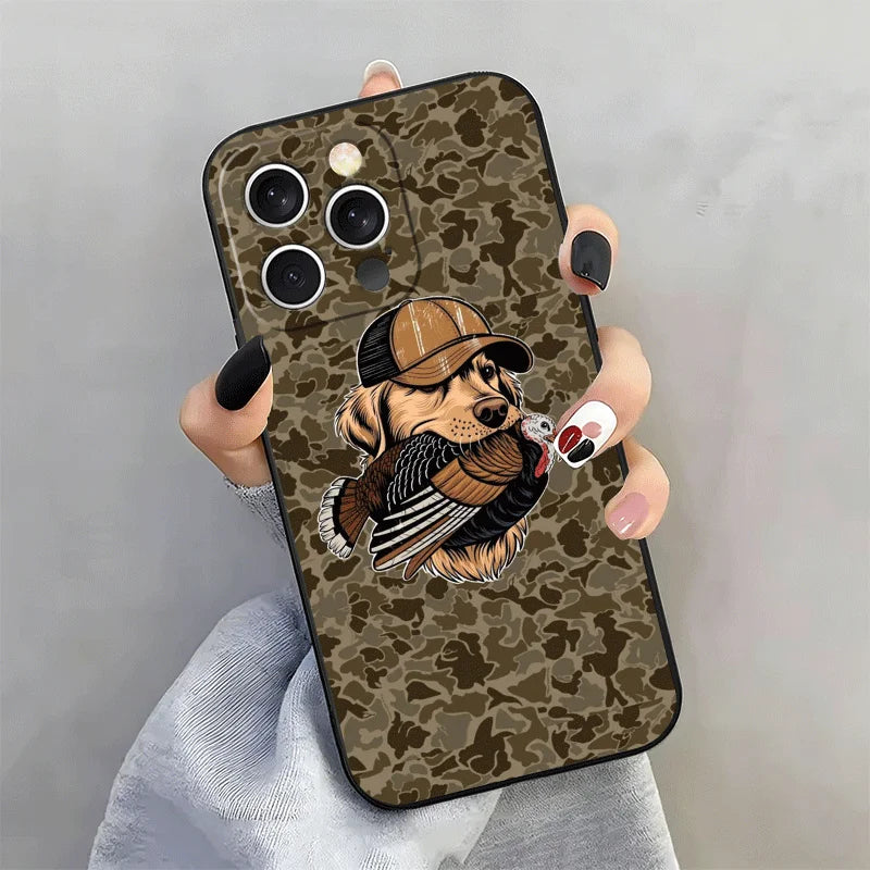 A hand holds a phone case featuring a hunting dog design in camouflage pattern.