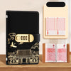 A black personal finance budget binder with a gold lock and a matching pink folder.