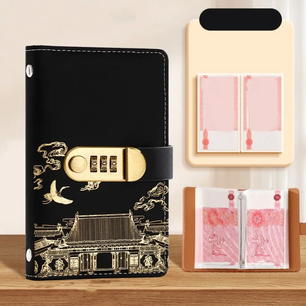 A black personal finance budget binder with a gold lock and a matching pink folder.