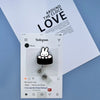 A silver badge reel with a cute Miffy rabbit charm is displayed on a white Instagram post.